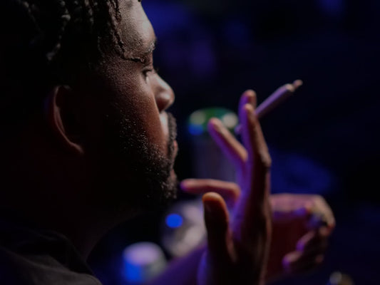 a man smoking a joint